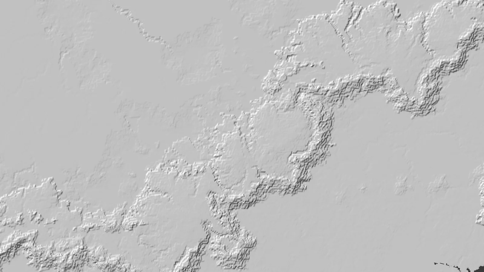 The planet's source heightmap over a mountain belt at 9.8 km per pixel, enlarged and shown as hillshade; the belt is blocky and its ridges are single pixels